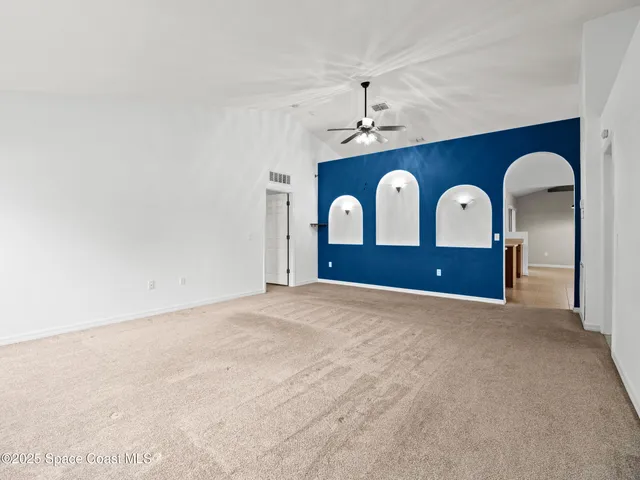 a view of a kitchen with furniture and window