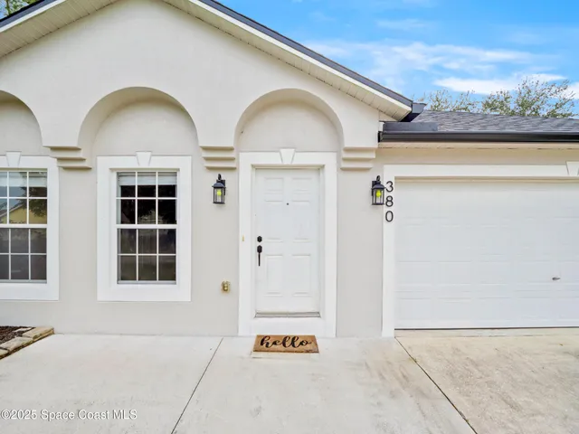 a view of a brick house with windows