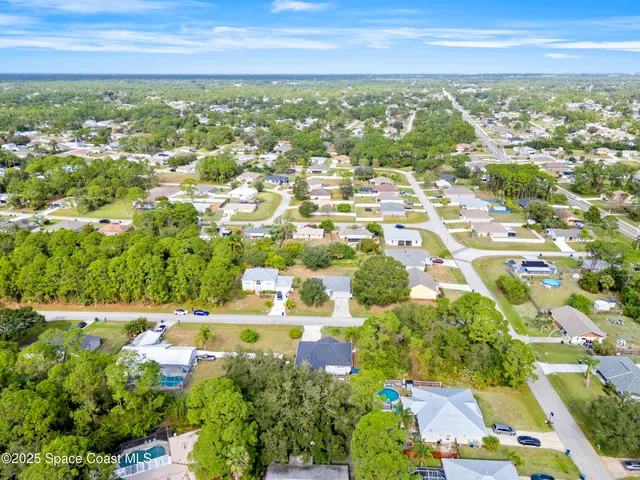 an aerial view of residential building with parking space