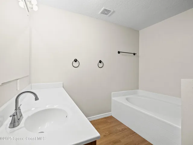 a bathroom with a white bath tub