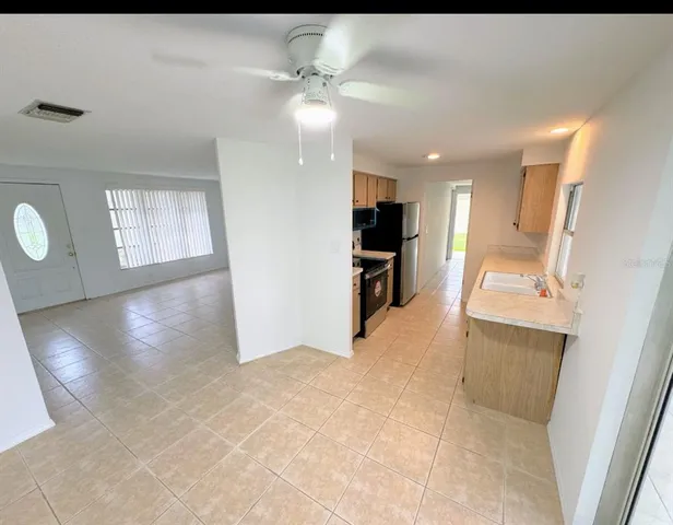 a view of a kitchen cabinets and a stove