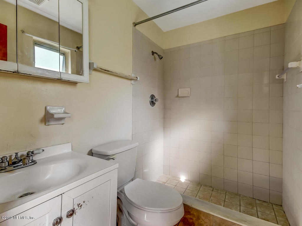 1060 Player Road Jacksonville, FL 32218 - Photo 24 of 37 a bathroom with a sink a toilet and shower