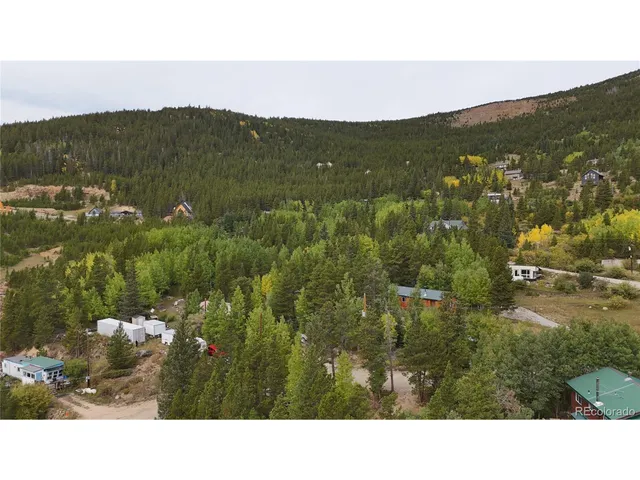 a open area with mountains in the background