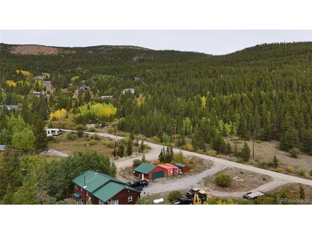a view of a couches and a table in the patio