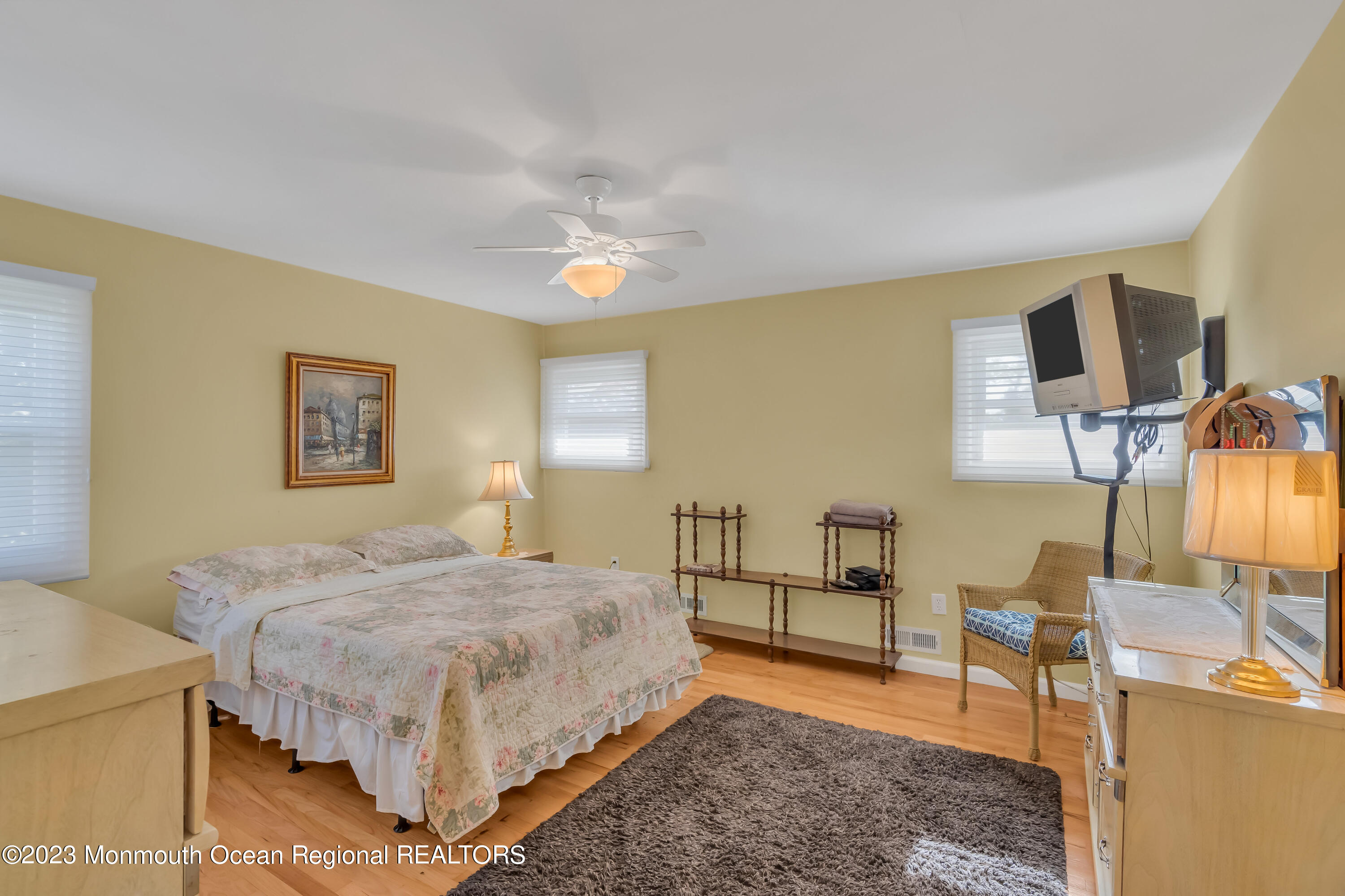1305 Allaire Road Spring Lake, NJ 07762 - Photo 12 of 27 a bedroom with a bed and wooden floor