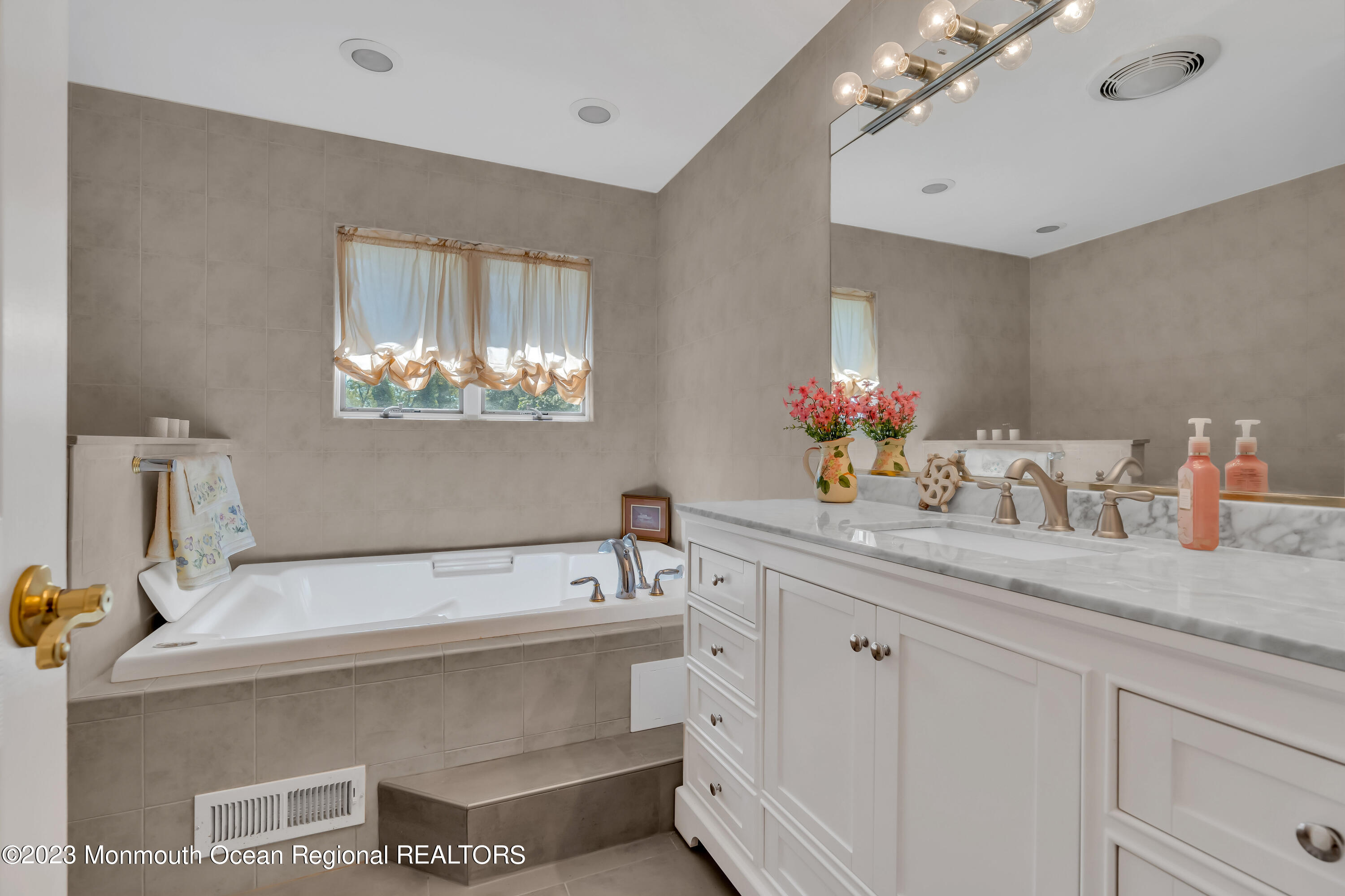 1305 Allaire Road Spring Lake, NJ 07762 - Photo 15 of 27 a bath room with a sink and a mirror