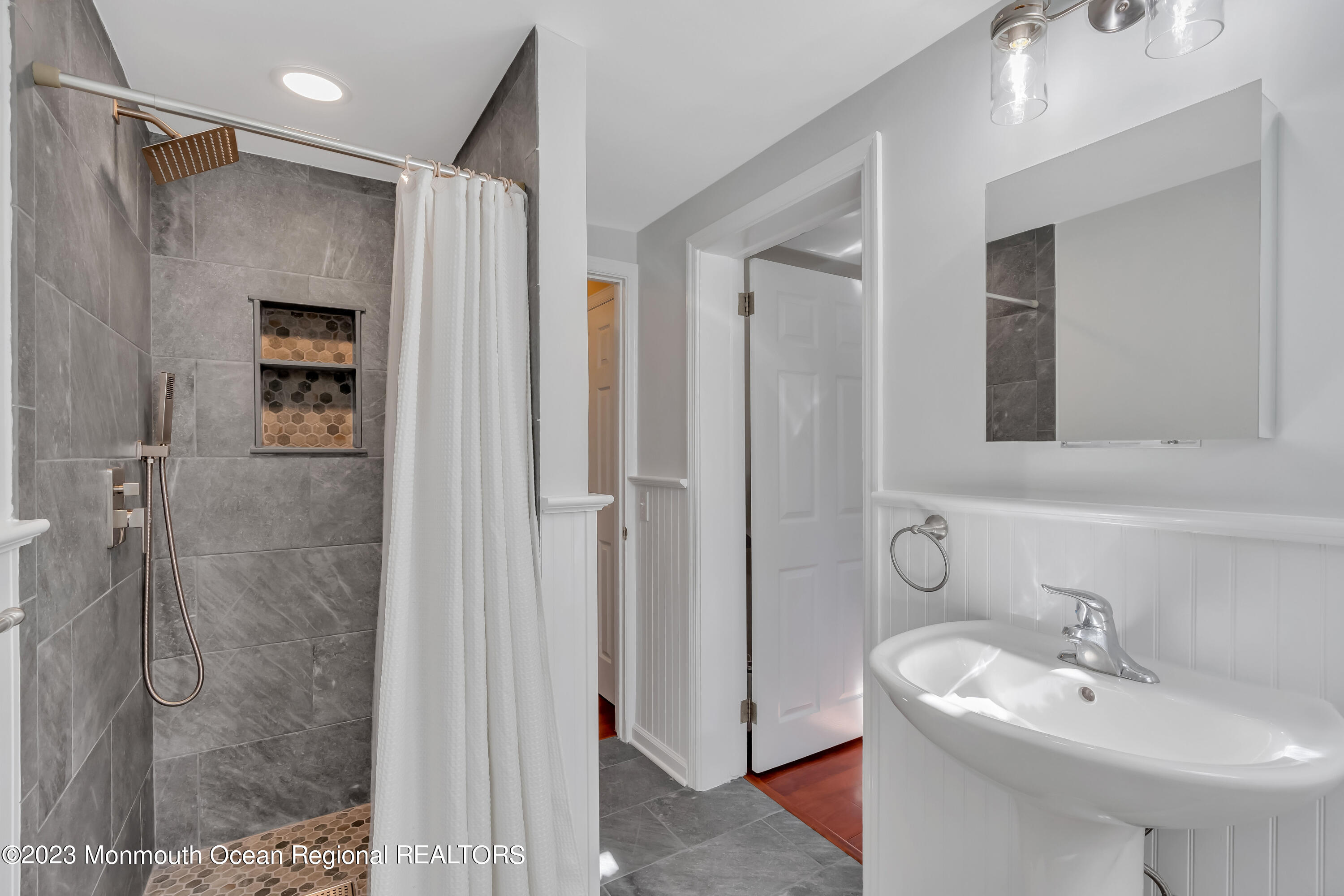 1305 Allaire Road Spring Lake, NJ 07762 - Photo 19 of 27 a bathroom with a sink toilet and shower