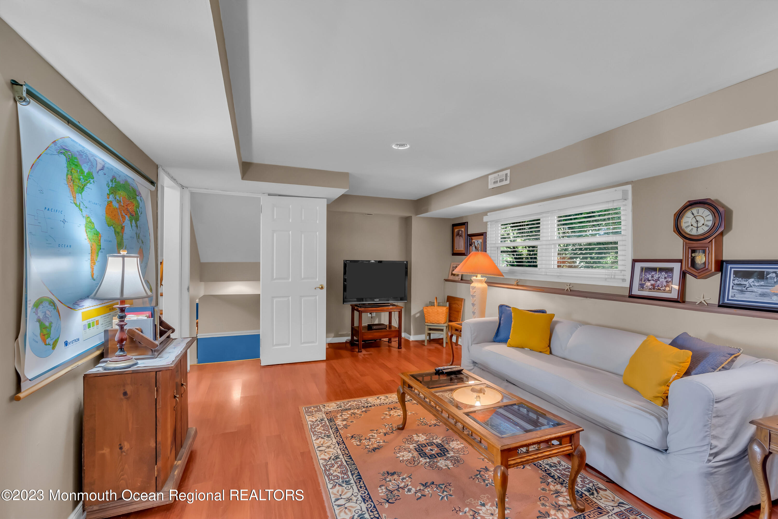 1305 Allaire Road Spring Lake, NJ 07762 - Photo 21 of 27 a living room with furniture and a flat screen tv