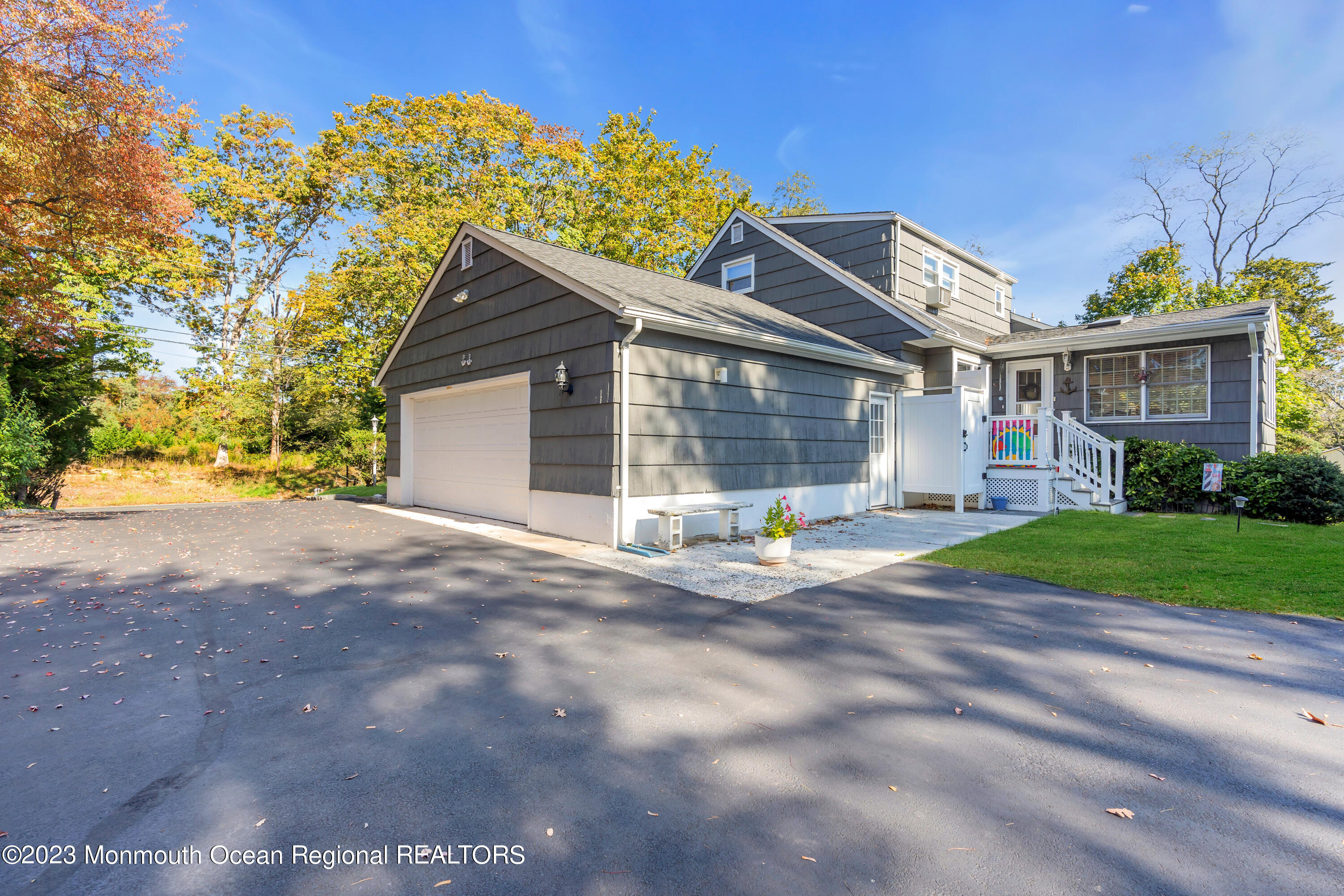 1305 Allaire Road Spring Lake, NJ 07762 - Photo 26 of 27 a view of a house with a yard and garage