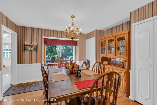 a view of a dining room with furniture window and outside view