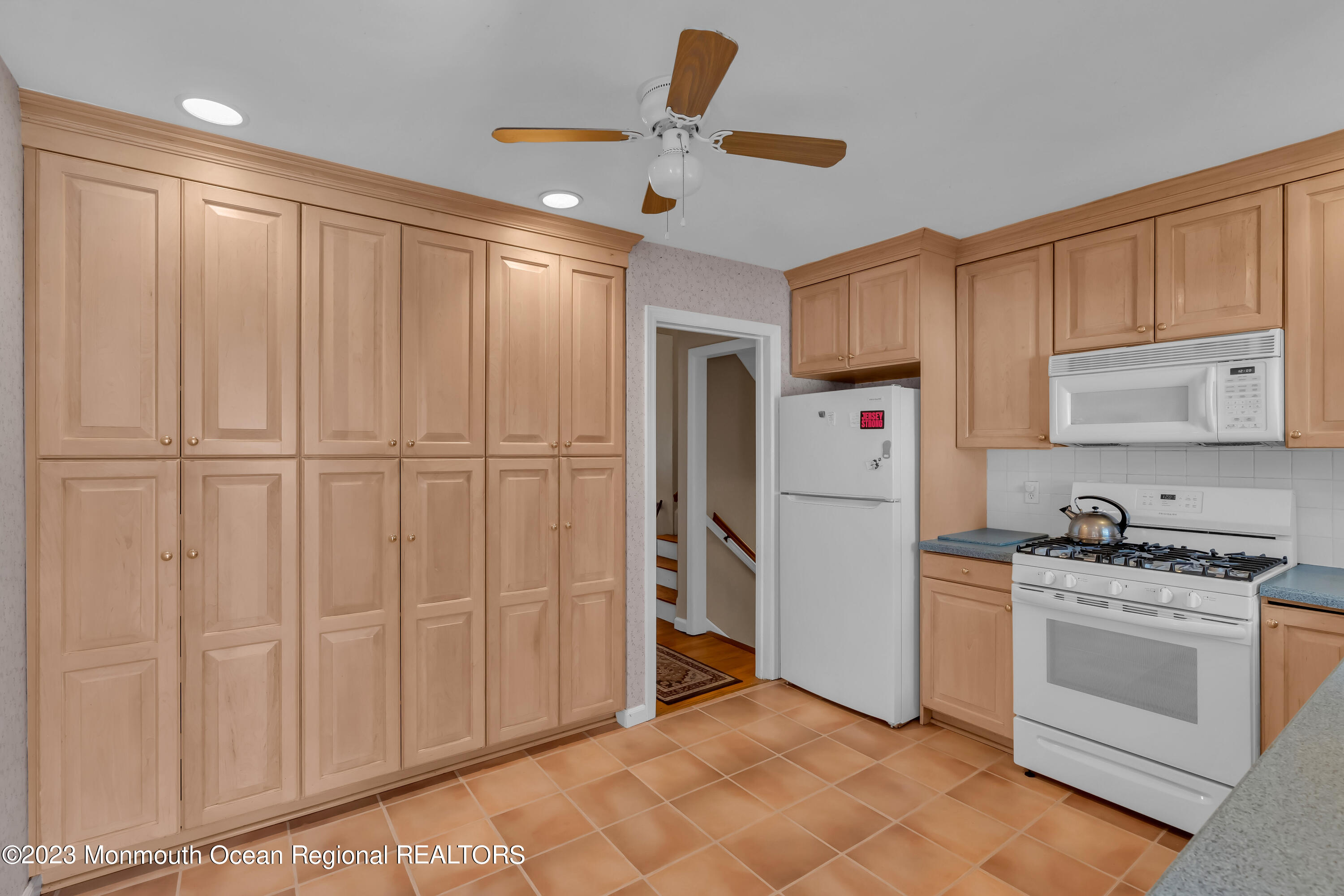 1305 Allaire Road Spring Lake, NJ 07762 - Photo 8 of 27 a kitchen with white cabinets and white appliances