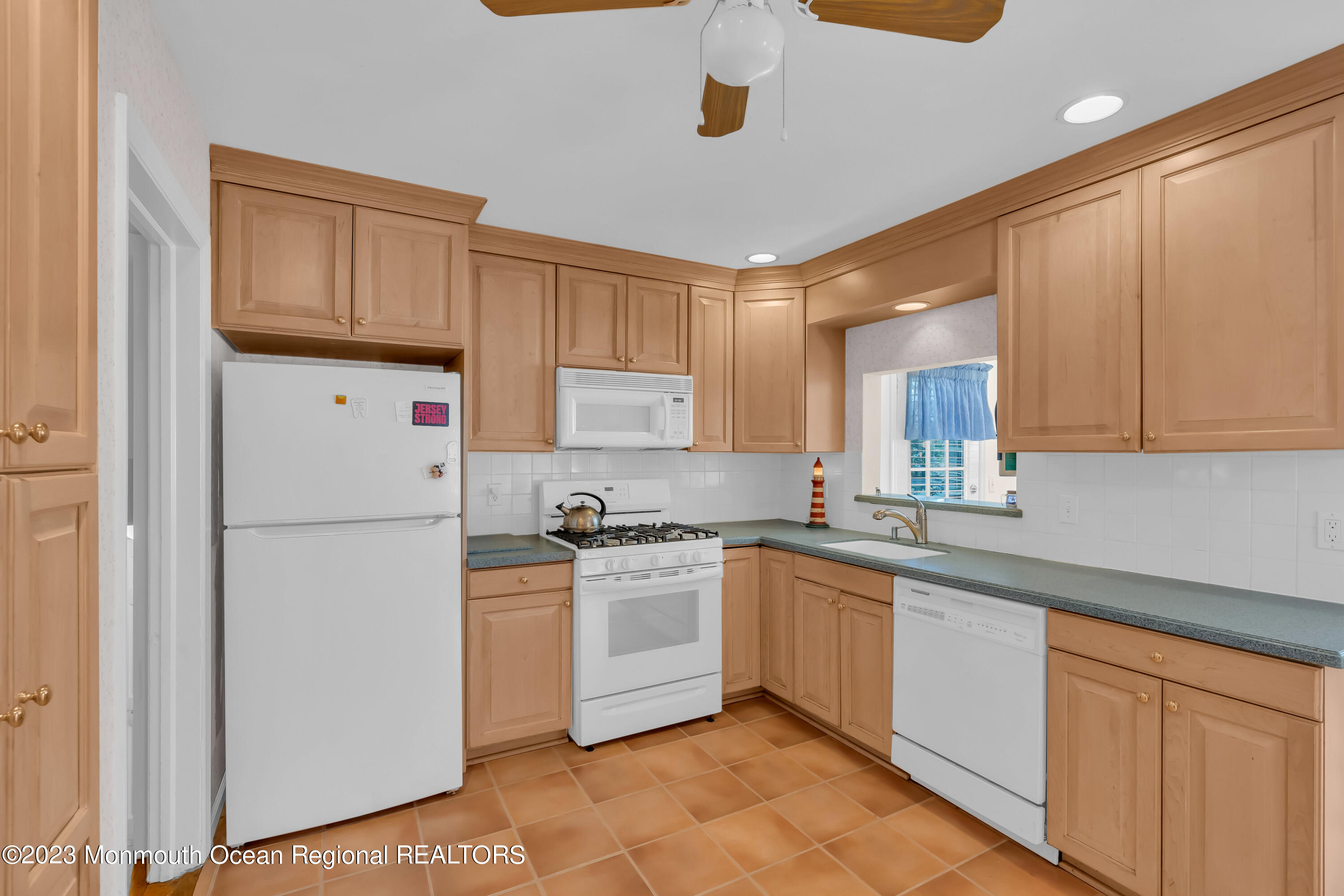 1305 Allaire Road Spring Lake, NJ 07762 - Photo 9 of 27 a kitchen with a white cabinets and refrigerator