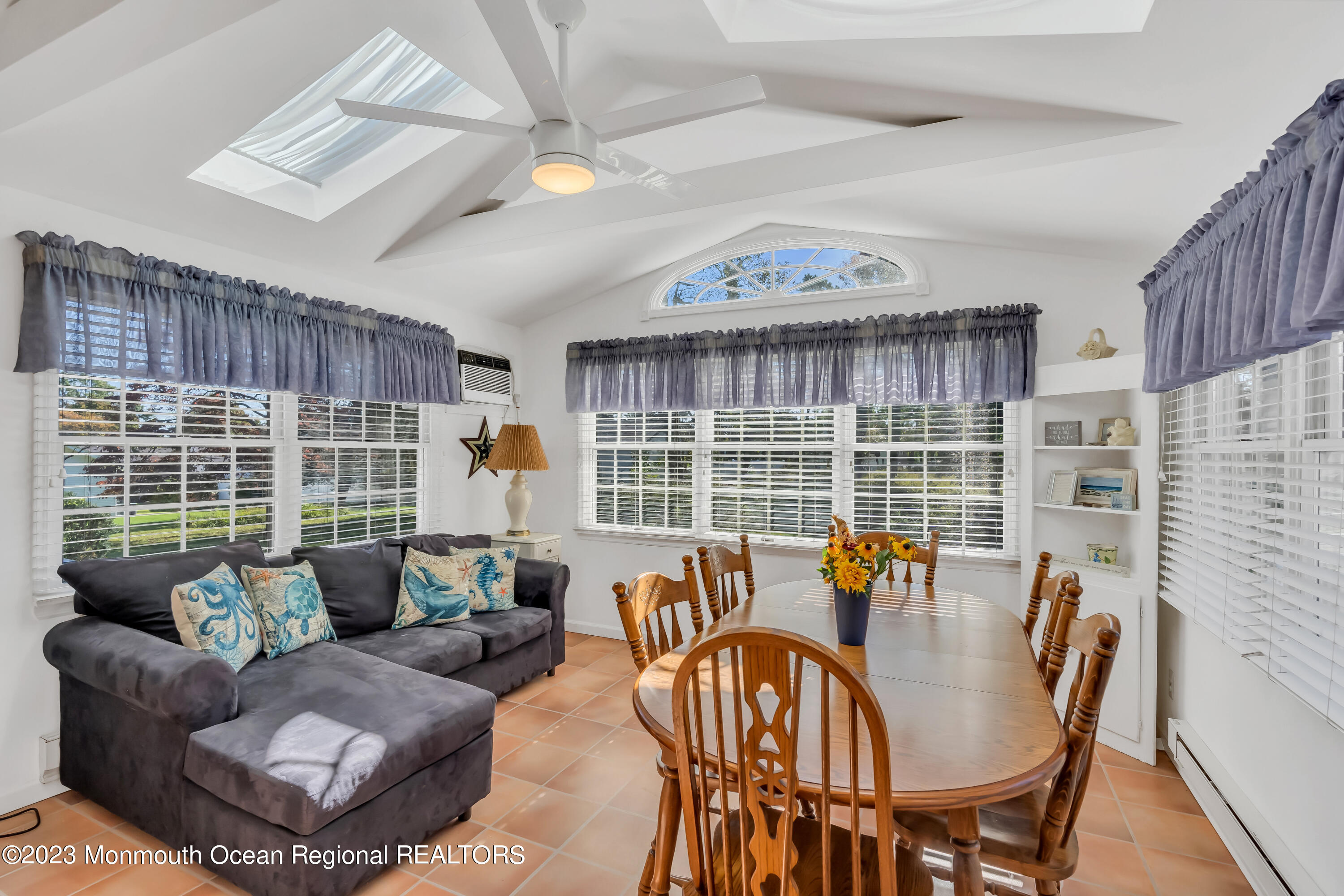 1305 Allaire Road Spring Lake, NJ 07762 - Photo 10 of 27 a living room with furniture and a large window