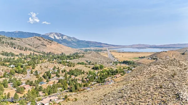 a view of a city with mountains in the background