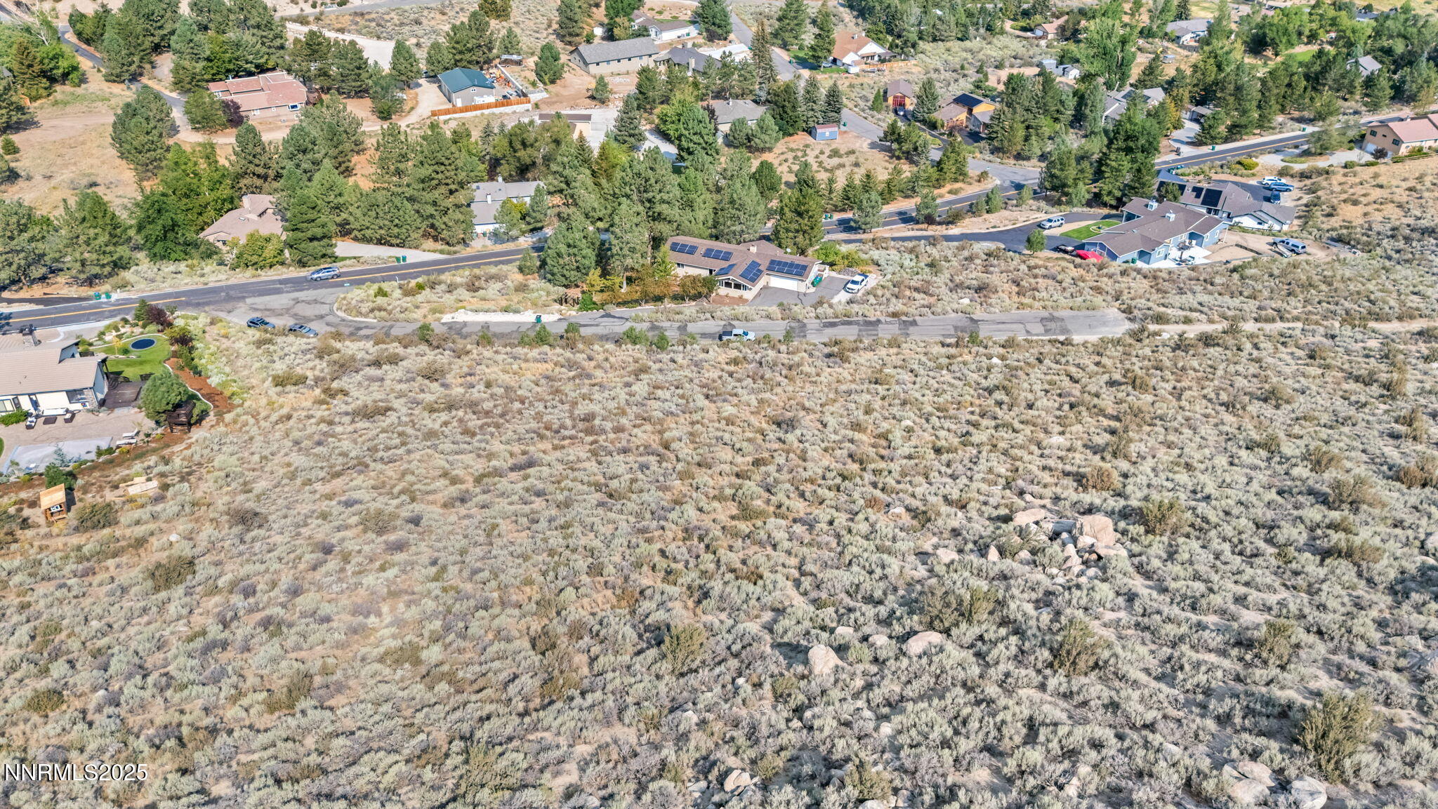 3733 Buckskin Road Carson City, NV 89703 - Photo 6 of 13 a view of a dry yard with wooden fence