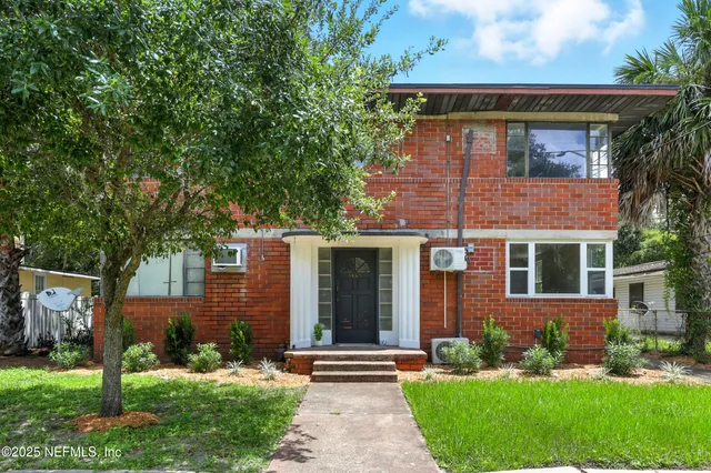 front view of a house with a yard
