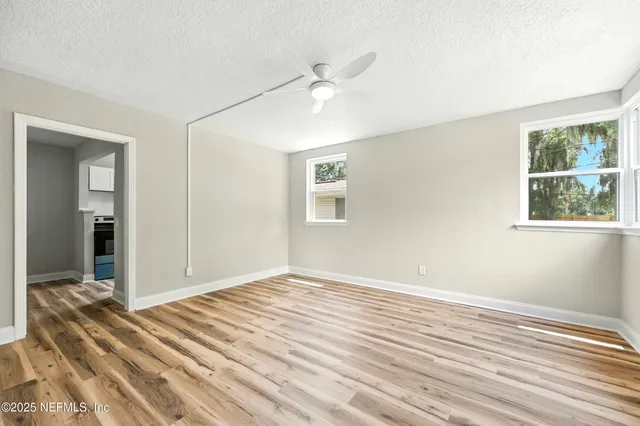 a view of an empty room with a window