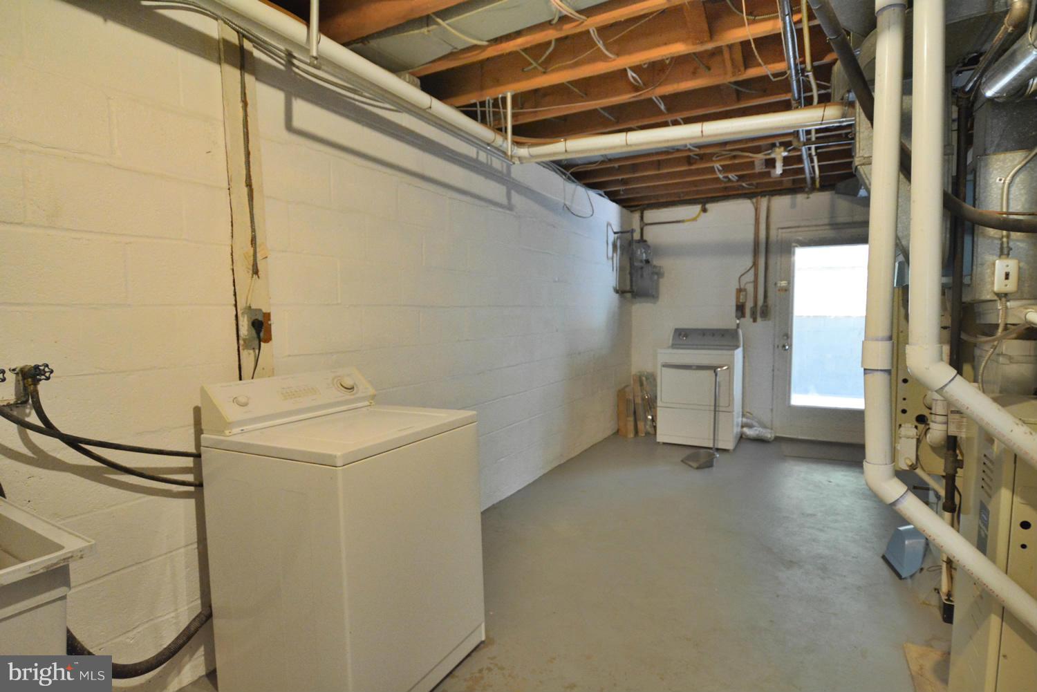 6229 Walhonding Road Bethesda, MD 20816 - Photo 8 of 26 Basement utility room and carport access