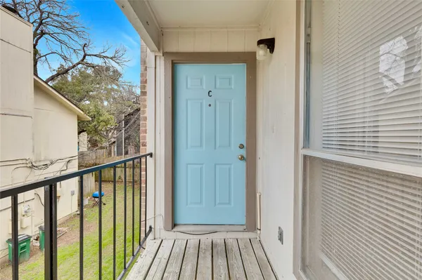 a view of a balcony with wooden floor