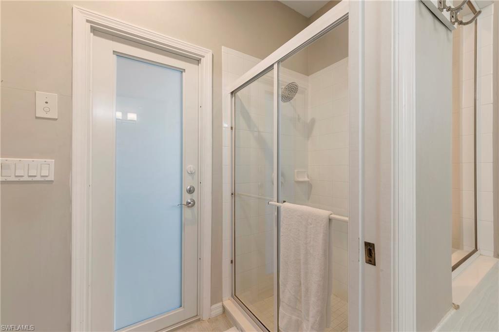 17819 Modena Road Fort Myers, FL 33913 - Photo 16 of 50 a bathroom with a shower and a glass door