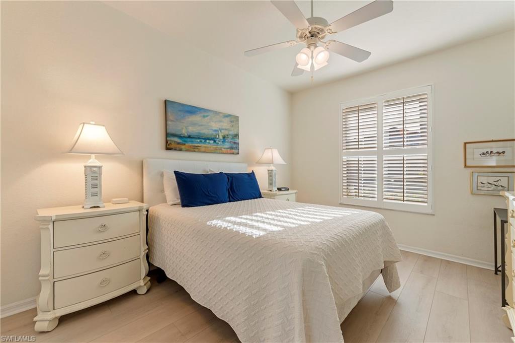 17819 Modena Road Fort Myers, FL 33913 - Photo 17 of 50 a bedroom with a bed and a night stand