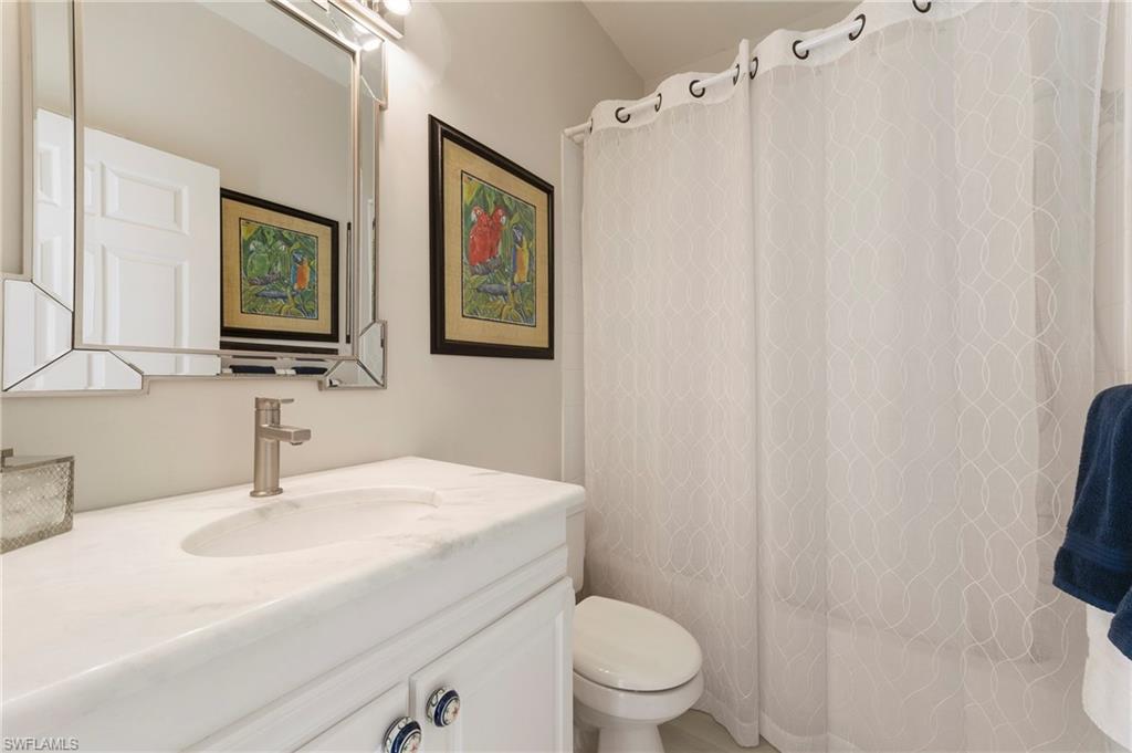 17819 Modena Road Fort Myers, FL 33913 - Photo 19 of 50 a bathroom with a sink mirror vanity and toilet