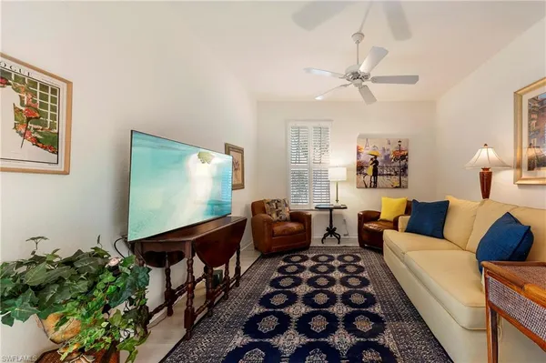 a living room with furniture and a rug