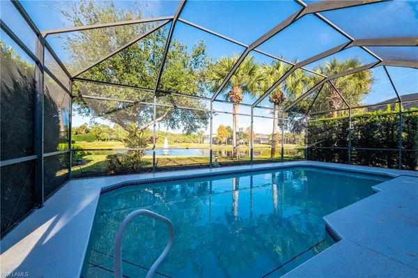 a view of a backyard with swimming pool