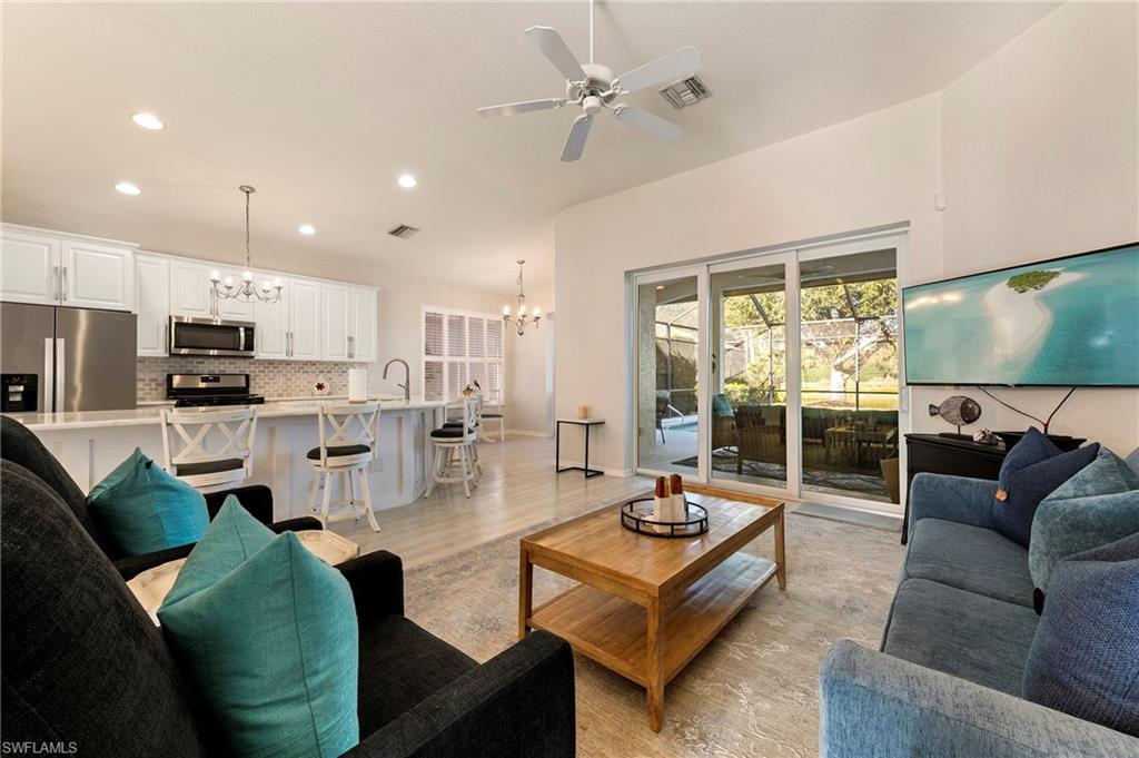 17819 Modena Road Fort Myers, FL 33913 - Photo 6 of 50 a living room with furniture and a large window