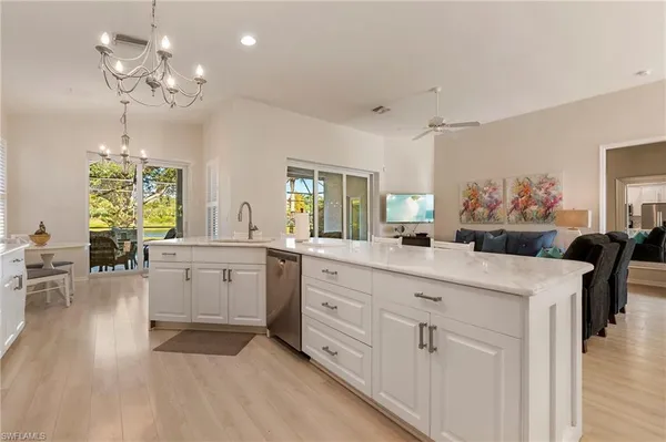 a spacious bathroom with a granite countertop sink a large mirror and a