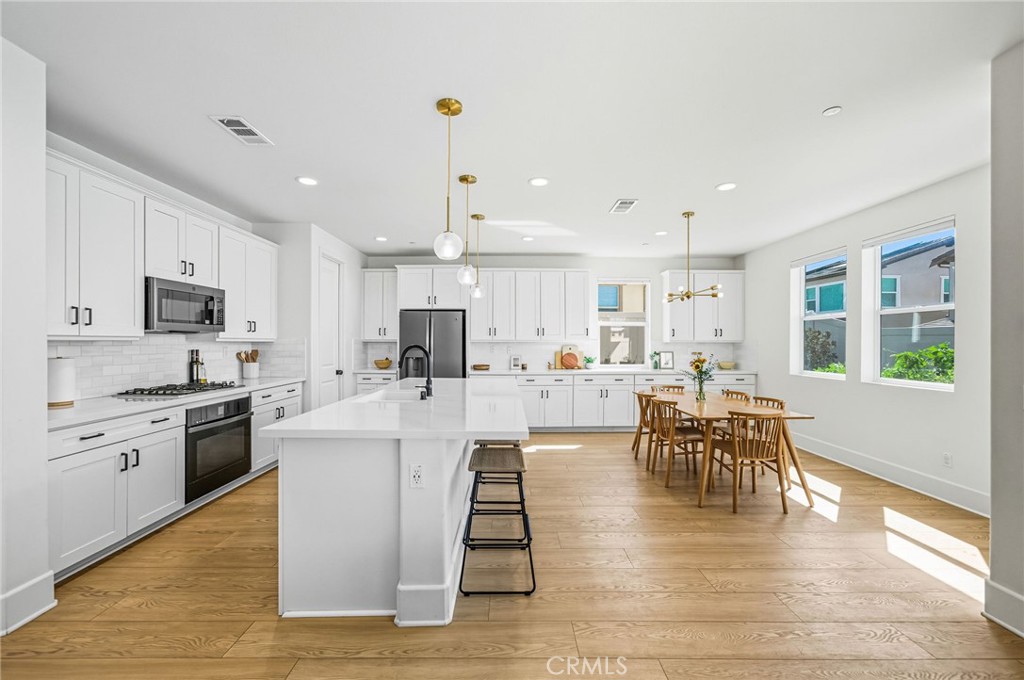 32017 Radiant Drive Temecula, CA 92591 - Photo 17 of 74 a living room with stainless steel appliances granite countertop furniture wooden floor and a kitchen view