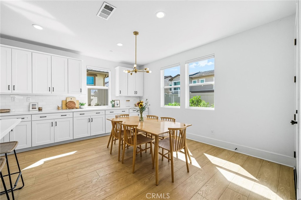 32017 Radiant Drive Temecula, CA 92591 - Photo 25 of 74 a open dining room with kitchen island stainless steel appliances furniture a dining table and chairs