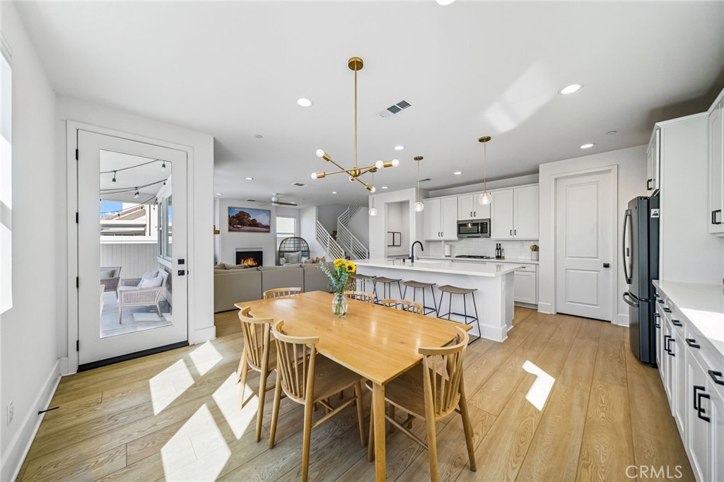 32017 Radiant Drive Temecula, CA 92591 - Photo 26 of 74 a kitchen with stainless steel appliances kitchen island granite countertop a refrigerator and microwave