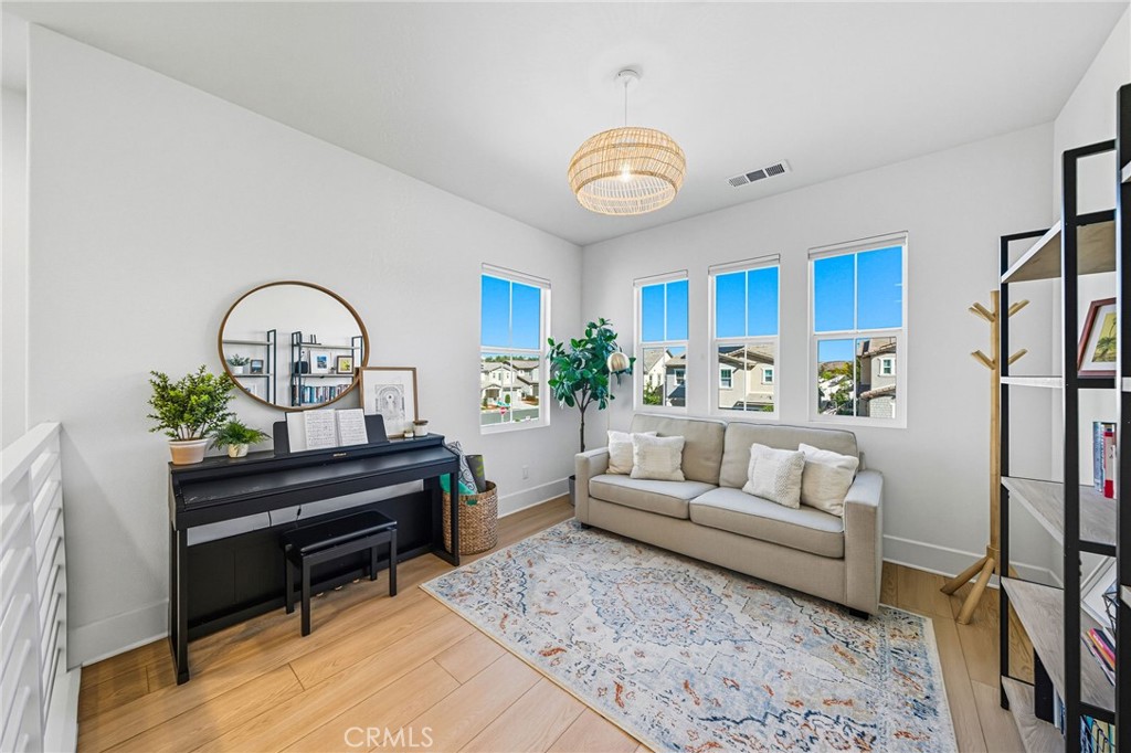 32017 Radiant Drive Temecula, CA 92591 - Photo 30 of 74 a living room with furniture flowerpot and a rug