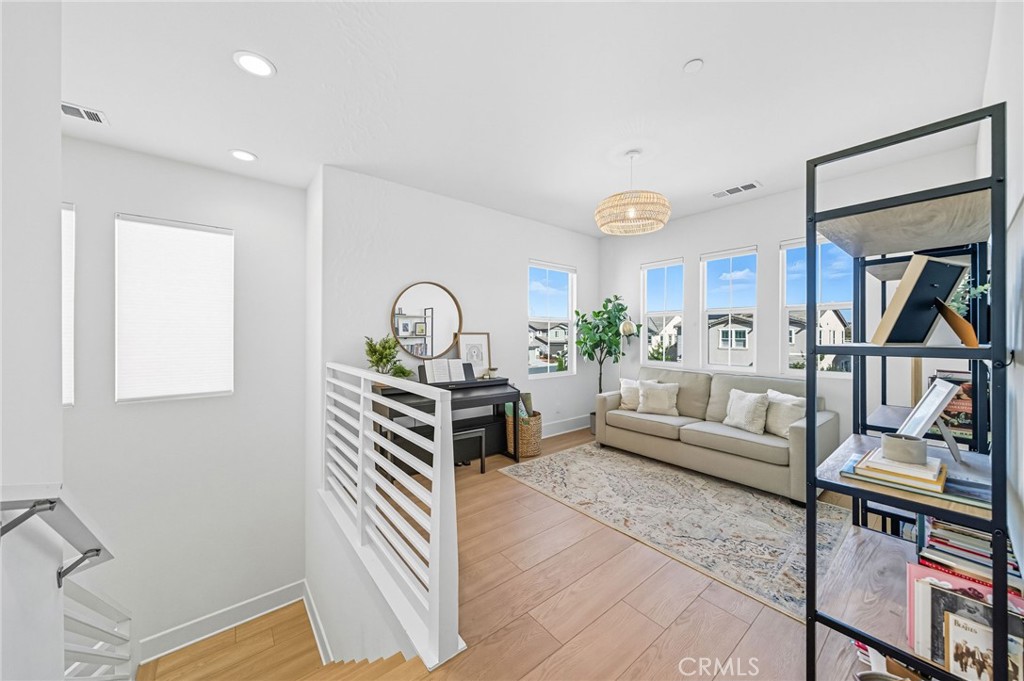 32017 Radiant Drive Temecula, CA 92591 - Photo 32 of 74 a living room with furniture and a wooden floor