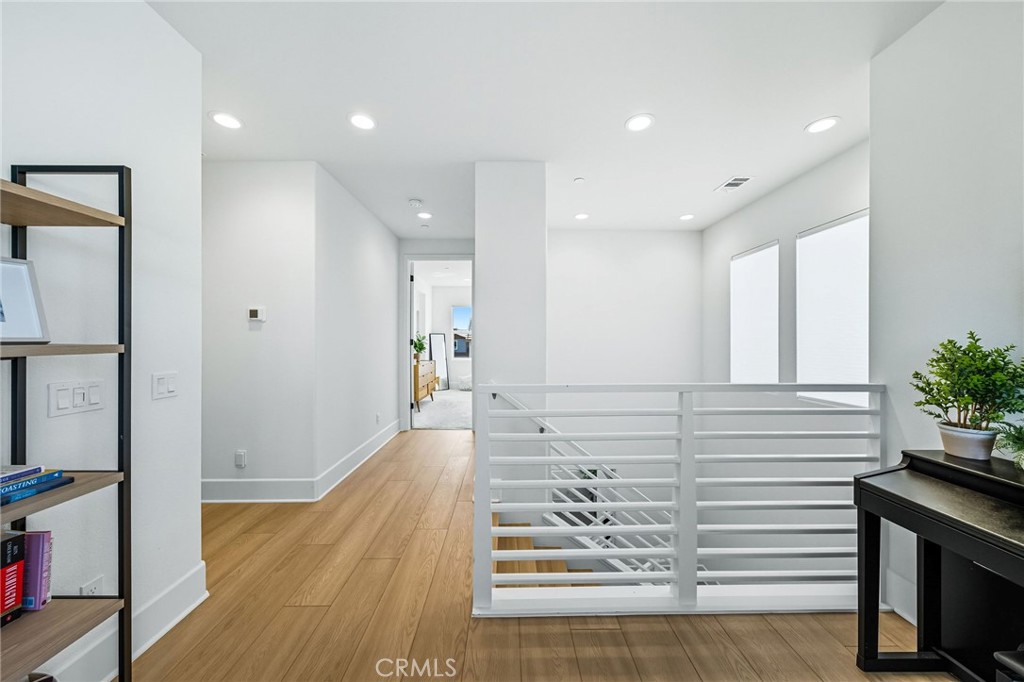 32017 Radiant Drive Temecula, CA 92591 - Photo 34 of 74 a view of a hallway with wooden floor and furniture