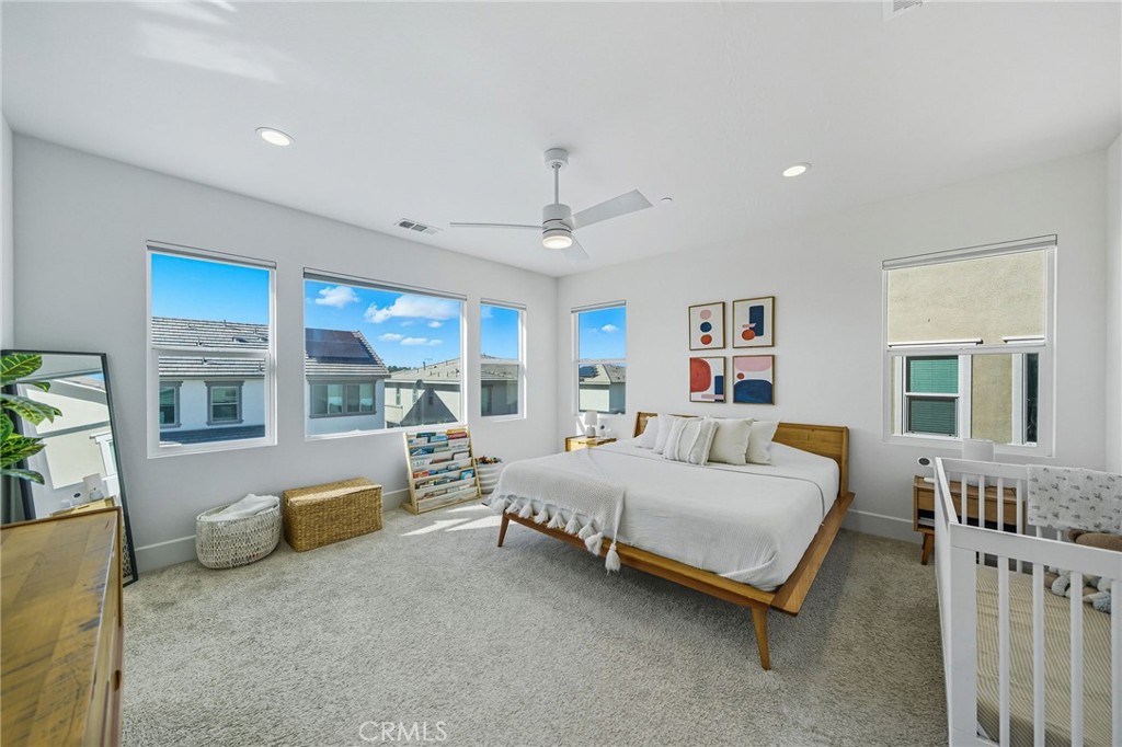 32017 Radiant Drive Temecula, CA 92591 - Photo 36 of 74 a bedroom with a bed couch and a window