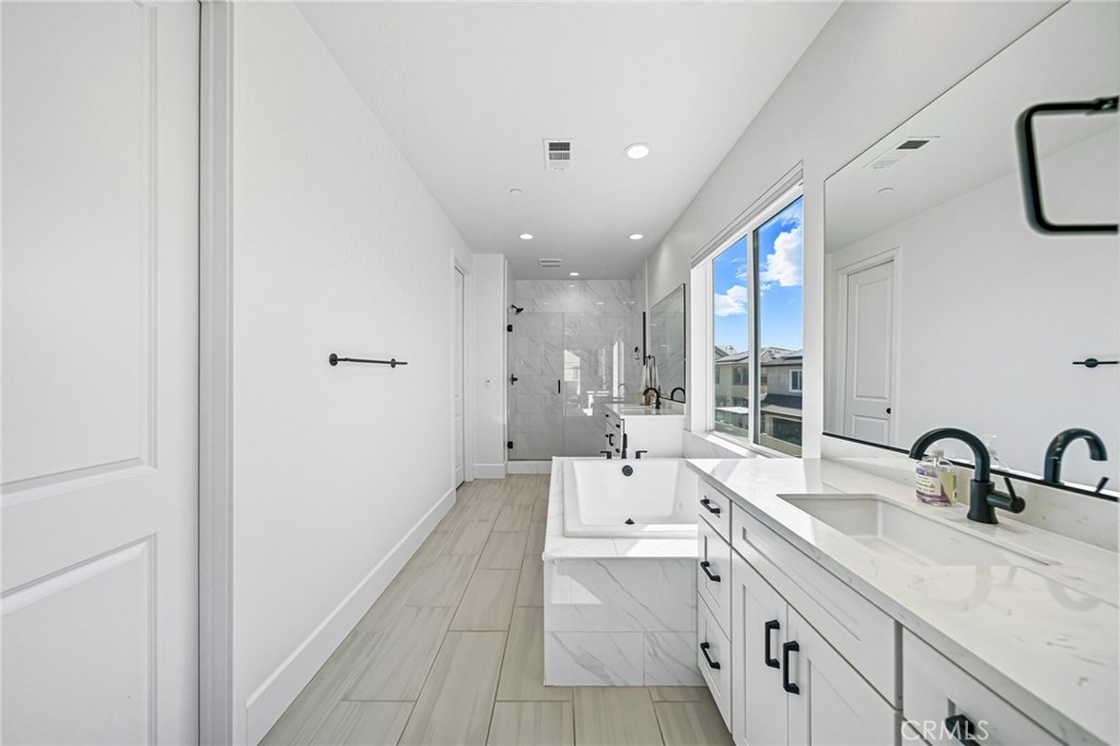 32017 Radiant Drive Temecula, CA 92591 - Photo 40 of 74 a large white room with a large window and double vanity
