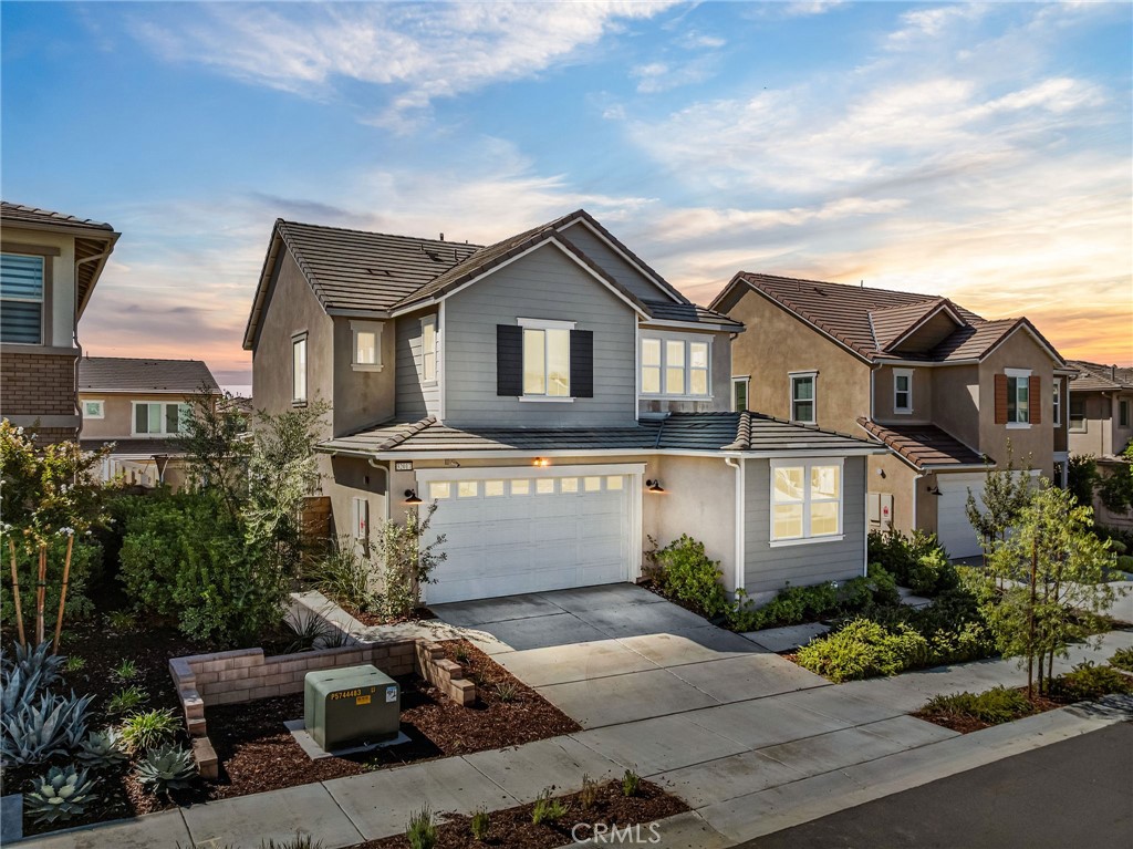 32017 Radiant Drive Temecula, CA 92591 - Photo 4 of 74 a front view of a house with a garden