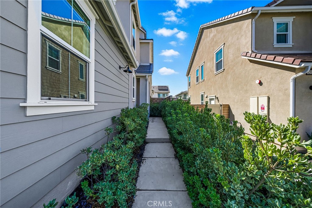 32017 Radiant Drive Temecula, CA 92591 - Photo 5 of 74 a view of a pathway with house on both side