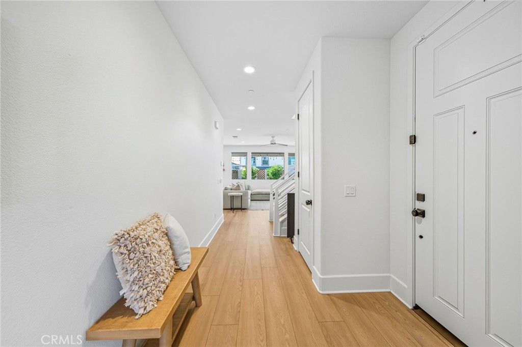 32017 Radiant Drive Temecula, CA 92591 - Photo 8 of 74 a view of a hallway with wooden floor and furniture