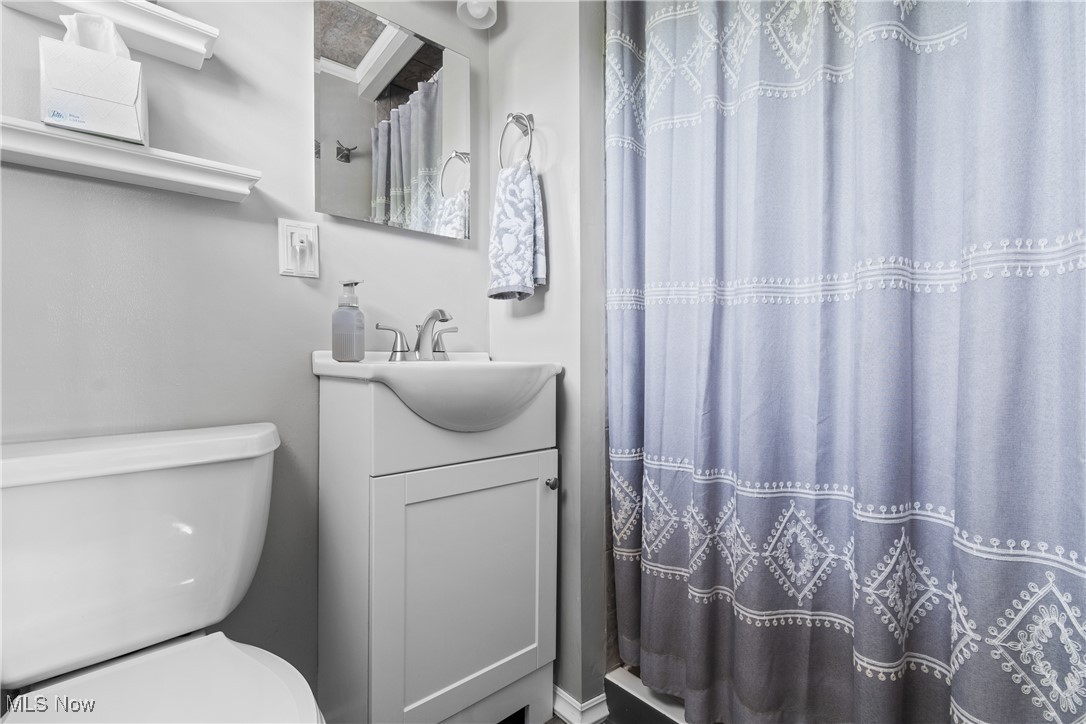 4606 9th Street Northwest Canton, OH 44708 - Photo 16 of 35 Bathroom featuring toilet and vanity