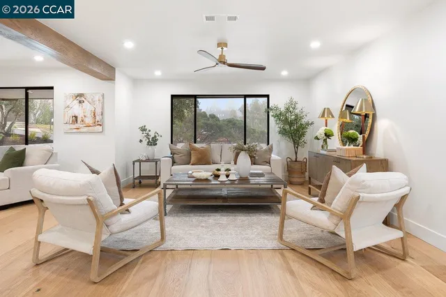 a living room with furniture and a table