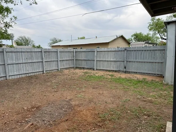 a view of a hallway with windows