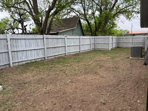 a view of a back yard of the house