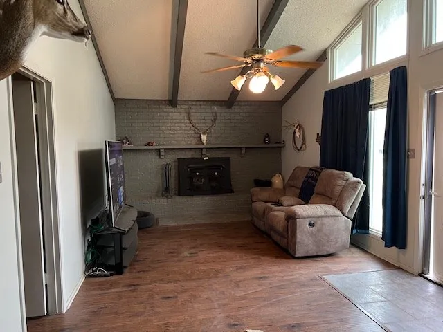 a view of a hallway with entryway and window