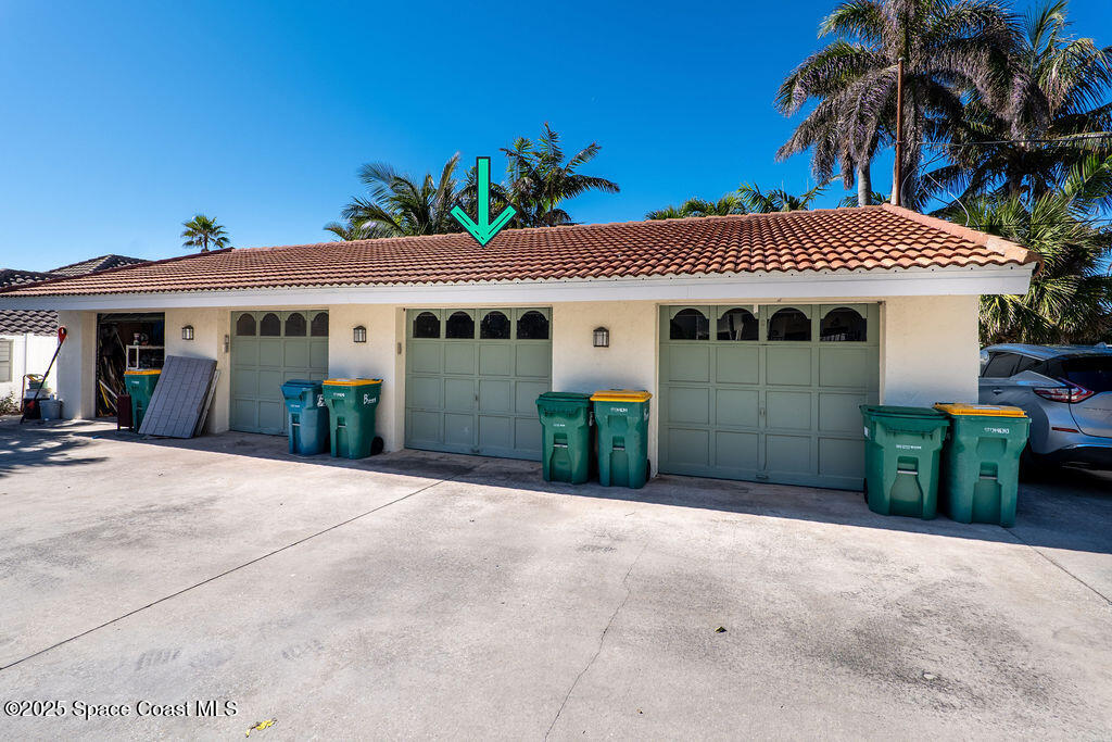 3044 South Hwy A1A, Unit 3C Melbourne Beach, FL 32951 - Photo 4 of 30 a view of a house with a yard and potted plants