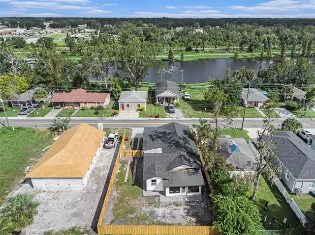 an aerial view of a house with a yard