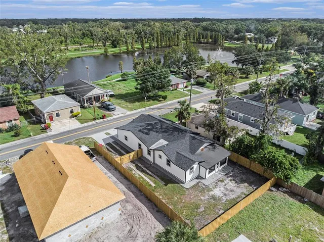 an aerial view of a house with a lake view