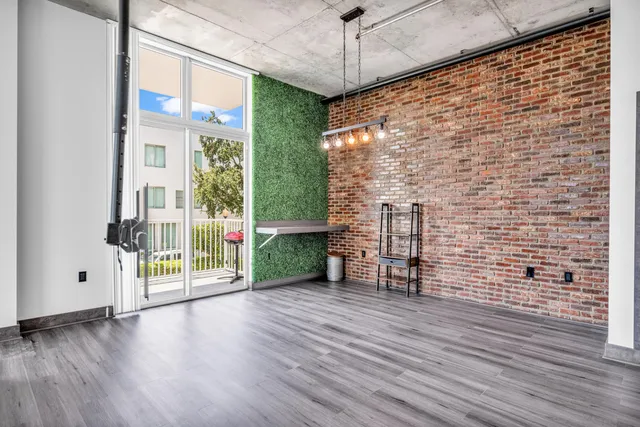 a view of an entryway with wooden floor